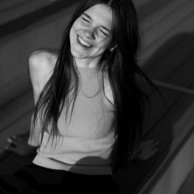 Kaveri Mehta, Lead Design Curator at North Bridge Flow, reviewing corporate floral arrangements